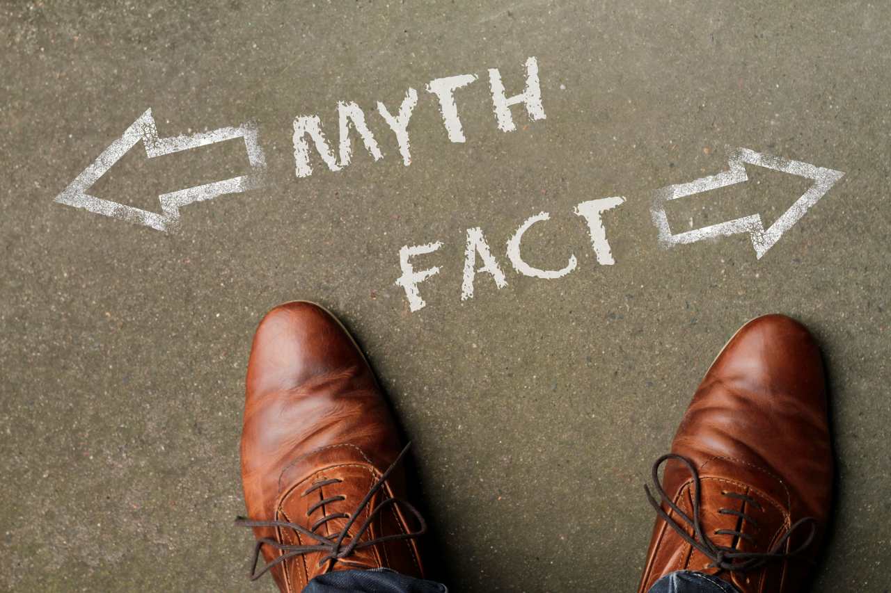debunking common myths and misconceptions about gynaecological health Man standing in front of two arrows and the words Myth and Fact