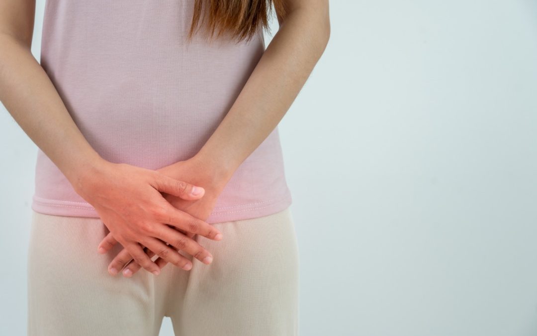 woman touching lower abdomen