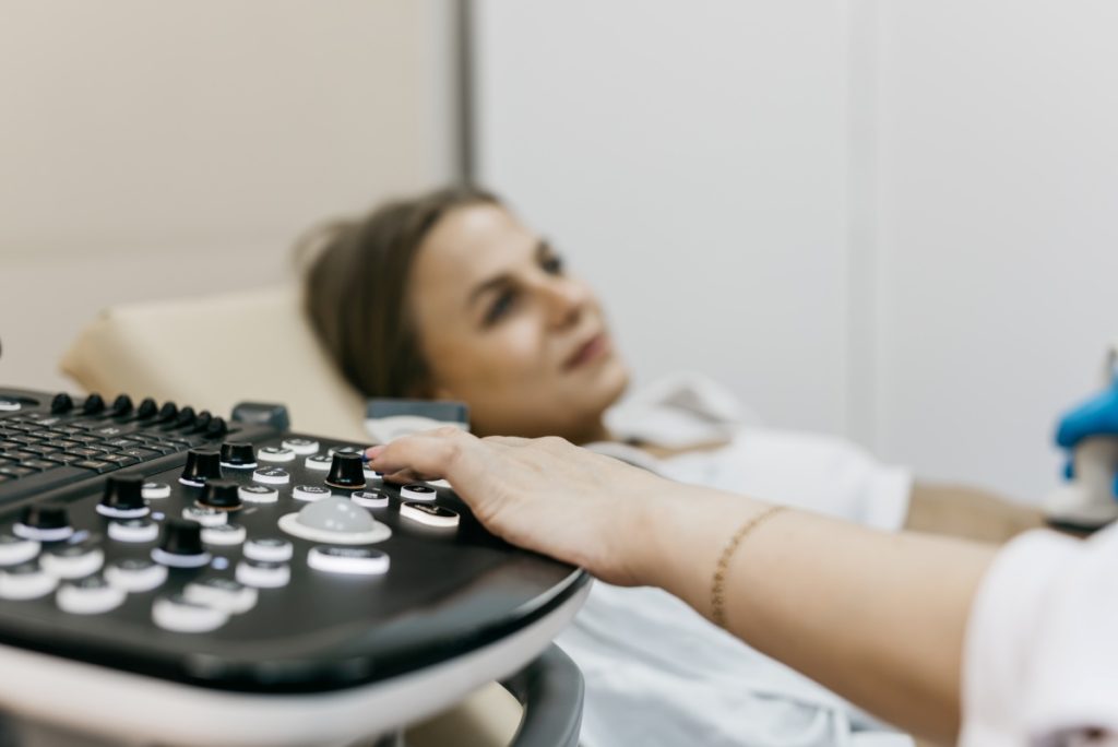 health care professional performs a scan