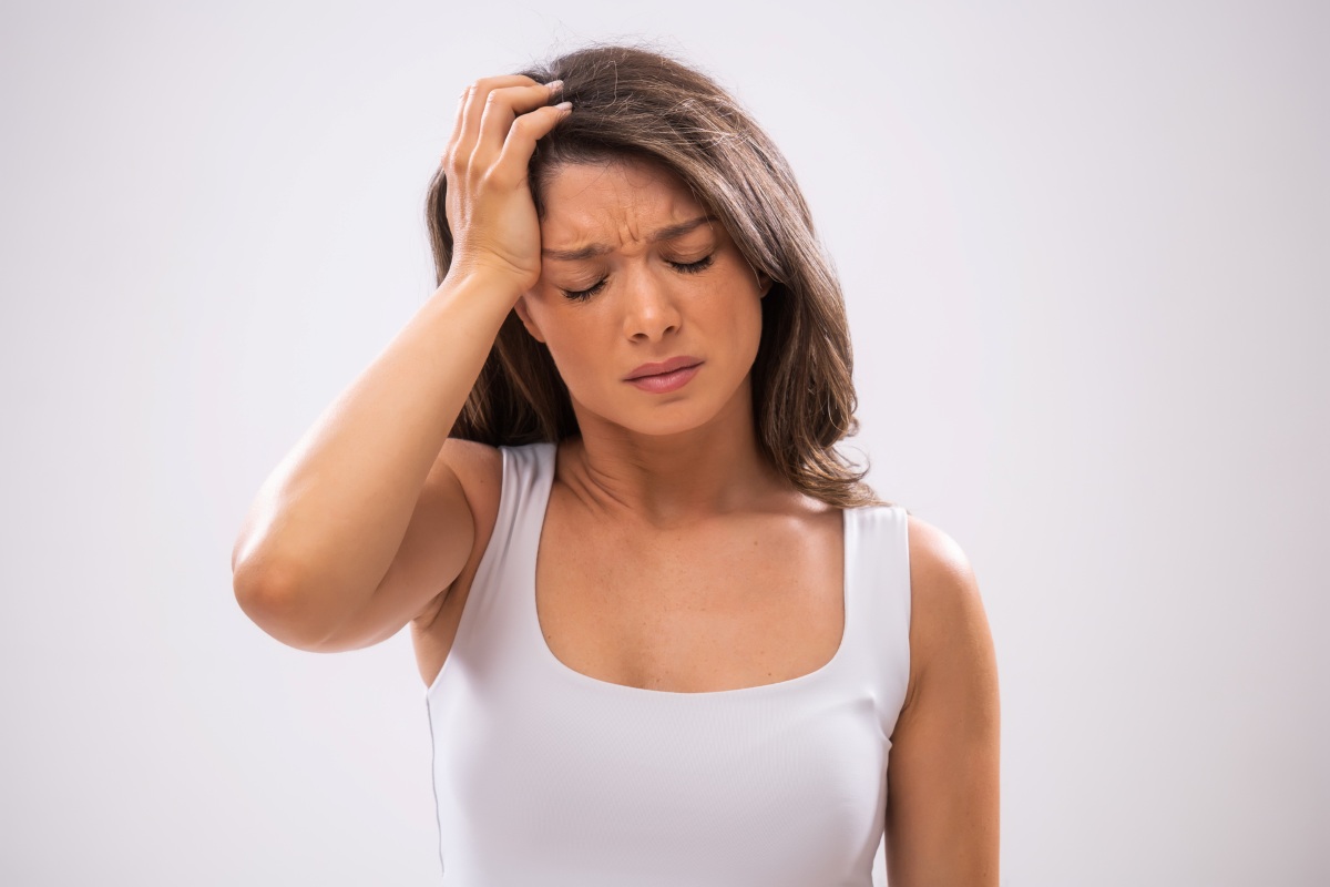 can stress delay your period Portrait of a beautiful woman who is anxious and exhausted