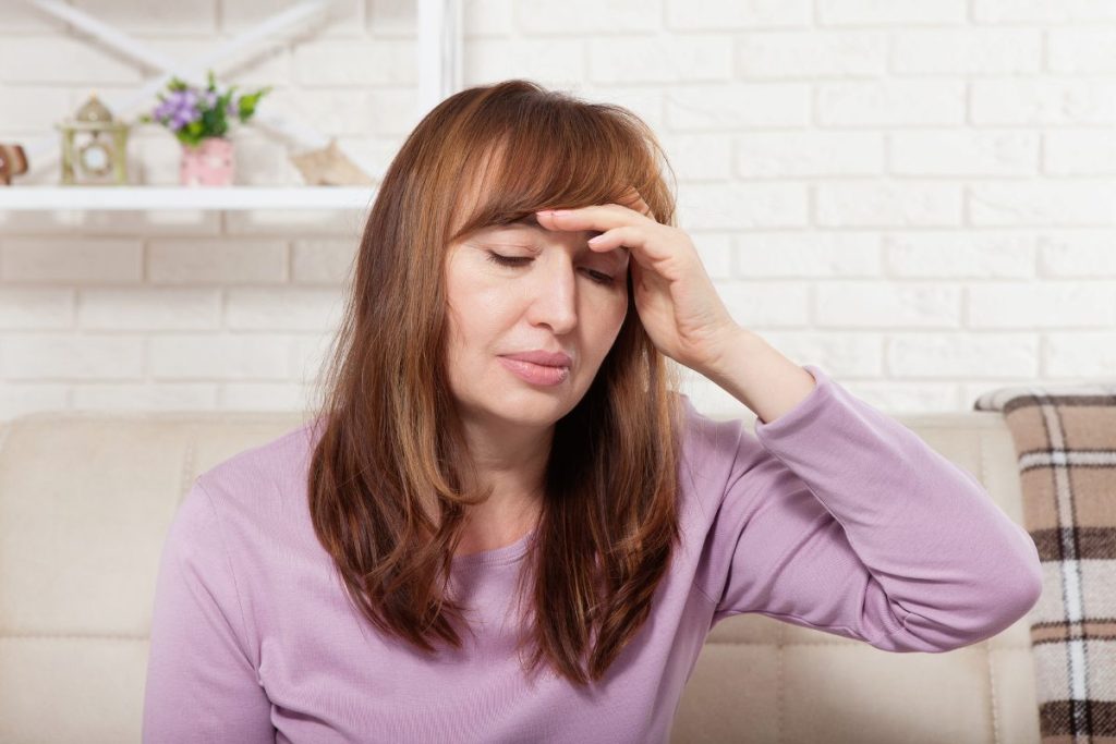 middle aged woman having headache
