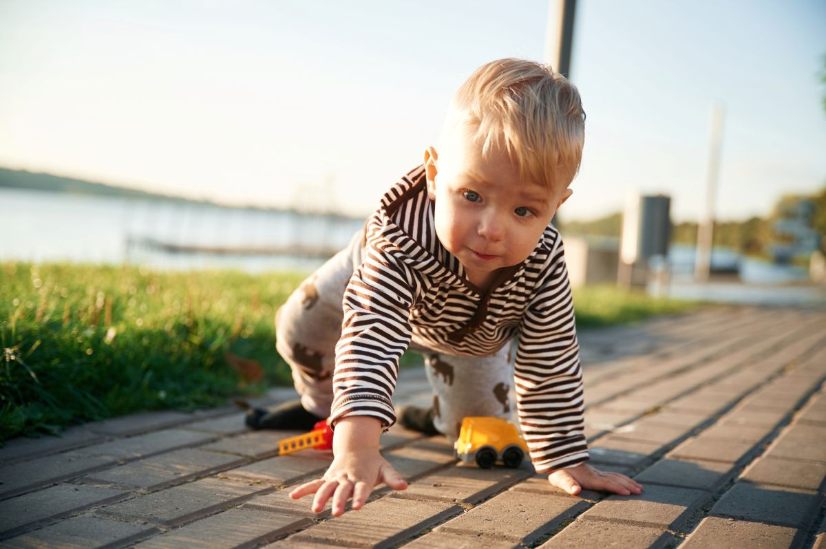 Cute little boy is having fun outdoors