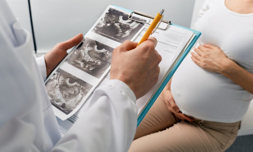 Visit to obstetrician gynecologist by pregnant woman for scheduled check-up